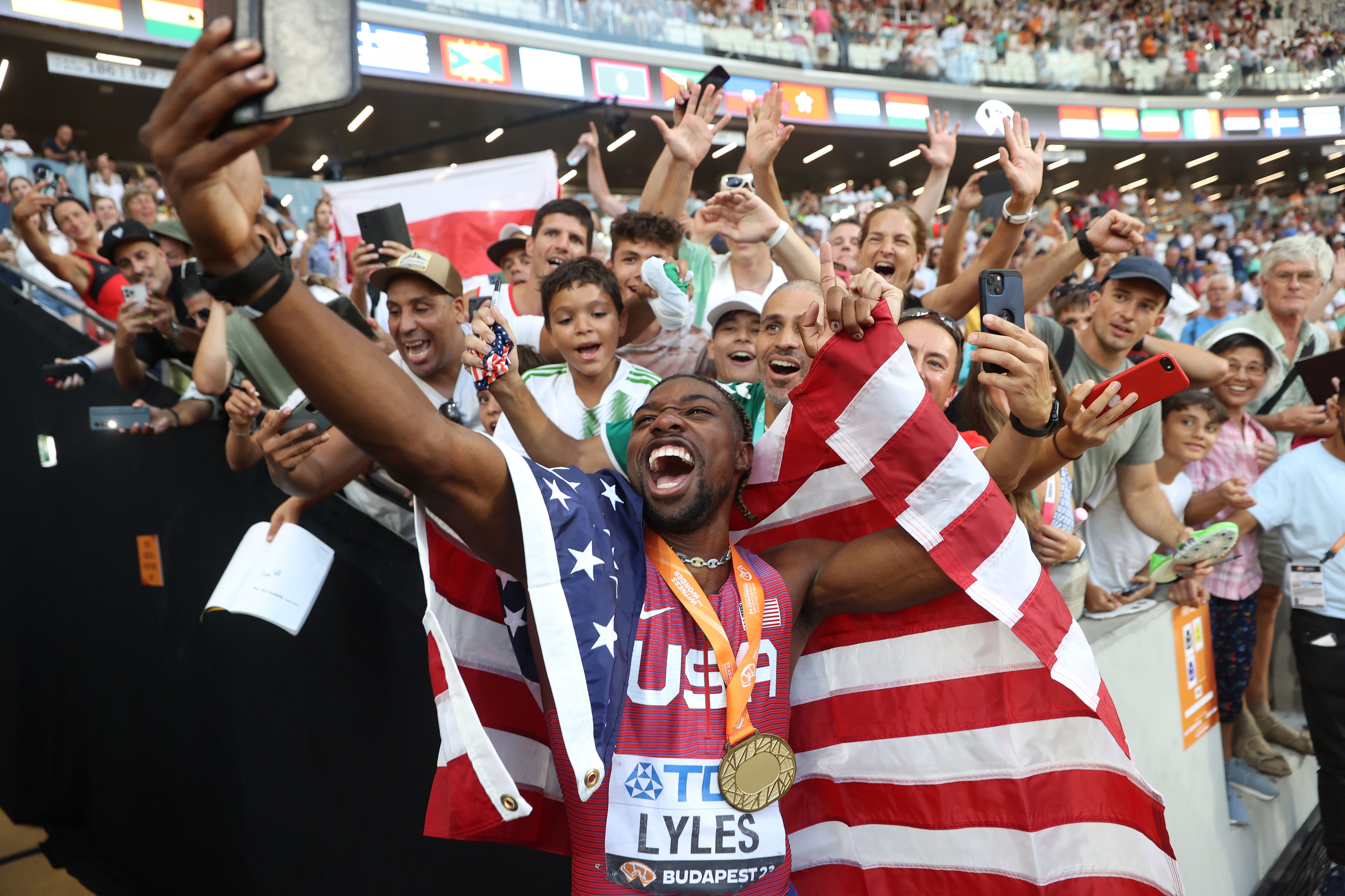 Noah Lyles celebrates with fans at the World Athletics Championships Budapest 23